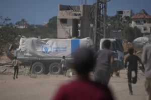 Aid trucks roll into Gaza as Hamas returns more hostage remains