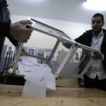 Algeria’s ruling coalition keeps control after low voter turnout