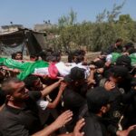 Gazans bury 112 members of one clan recovered from rubble